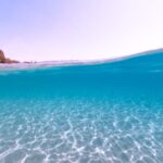 blue sea under blue sky during daytime